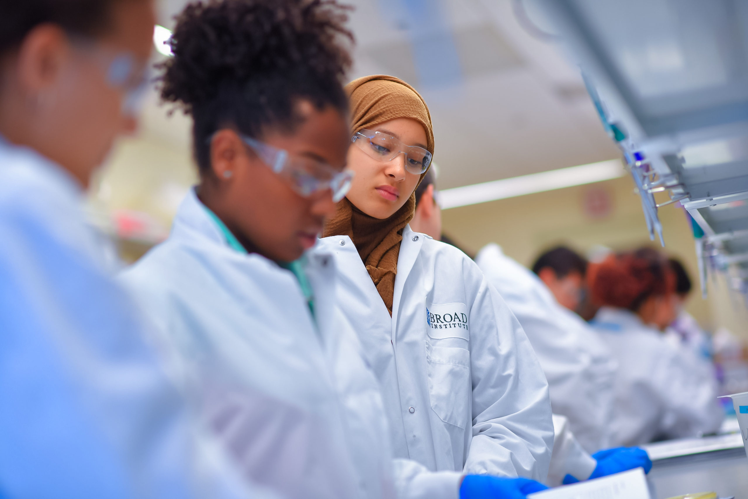 student looks at experiment in lab